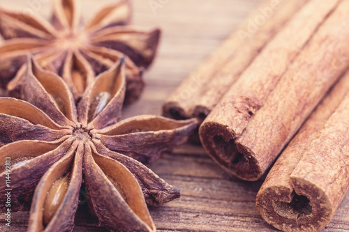 cinnamon and anise on a wooden background
