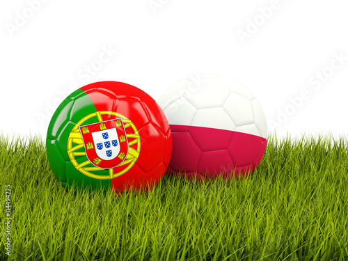 Portugal and Poland soccer  balls on grass