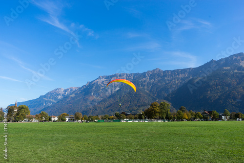 beautiful paragliding field near alpes mountain in switzerland