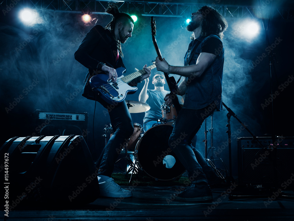 Naklejka premium Rock band performs on stage.