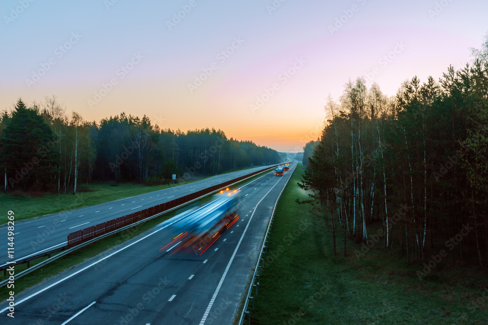Fototapeta premium high-speed traffic on the highway in the early morning