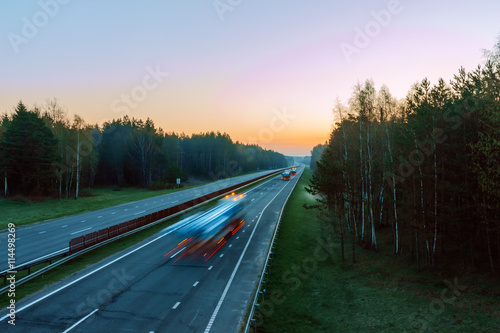 high-speed traffic on the highway in the early morning