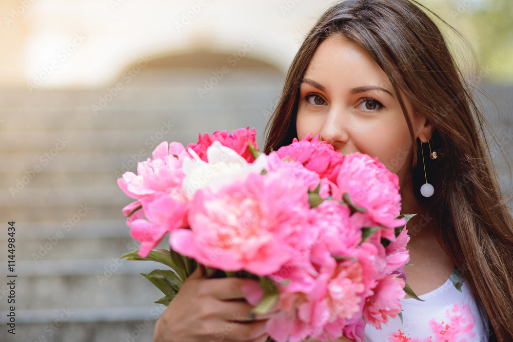 Woman with flowers peonies outdoors Woman with flowers peonies outdoors
