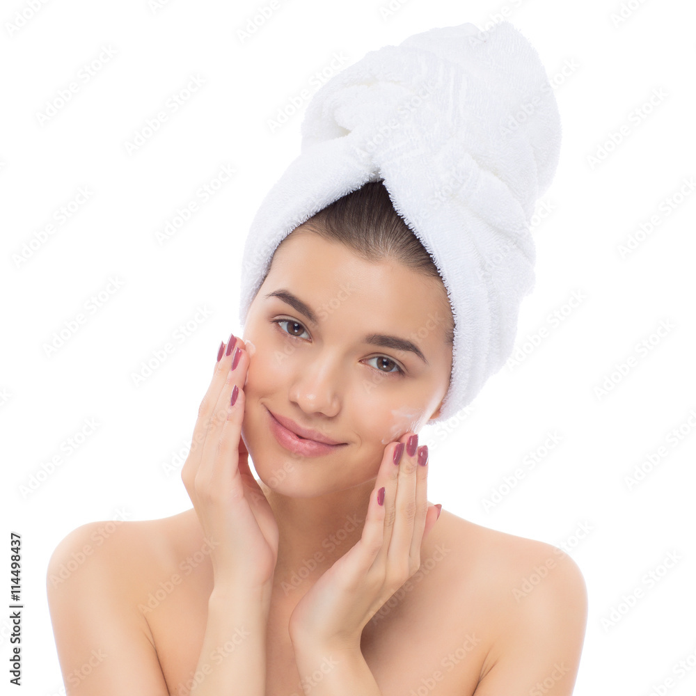 Beautiful woman with towel on head. The face cream. Beautiful woman with towel on head. The face cream.