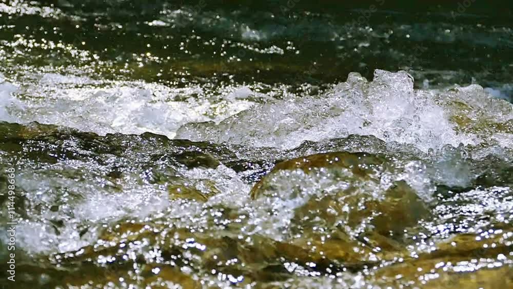 Slow motion. Mountain stream splashes or river close up
