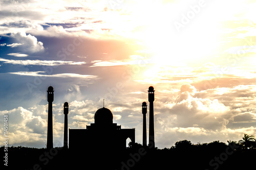 silhouette of masjid  on sky background photo