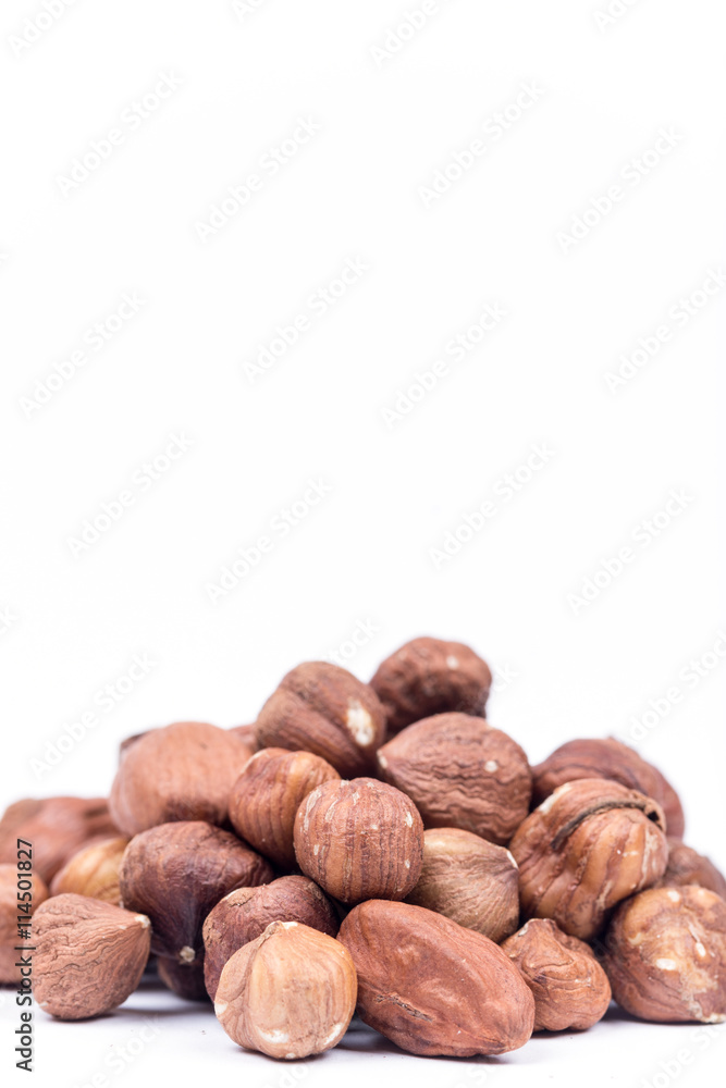 Bunch of hazelnuts over white background with copy space Bunch of hazelnuts over white background with copy space