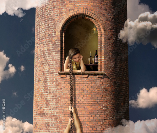 Rapunzel is waiting for her lover in a high tower. photo