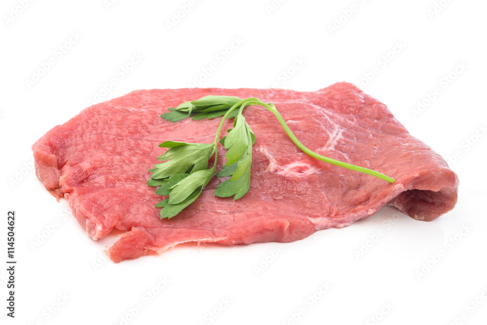 raw beef fillet with parsley on white raw beef fillet with parsley on white