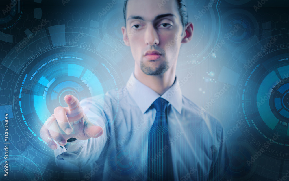 Businessman pressing virtual buttons in futuristic concept Businessman pressing virtual buttons in futuristic concept