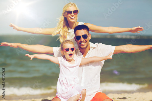 happy family having fun on summer beach