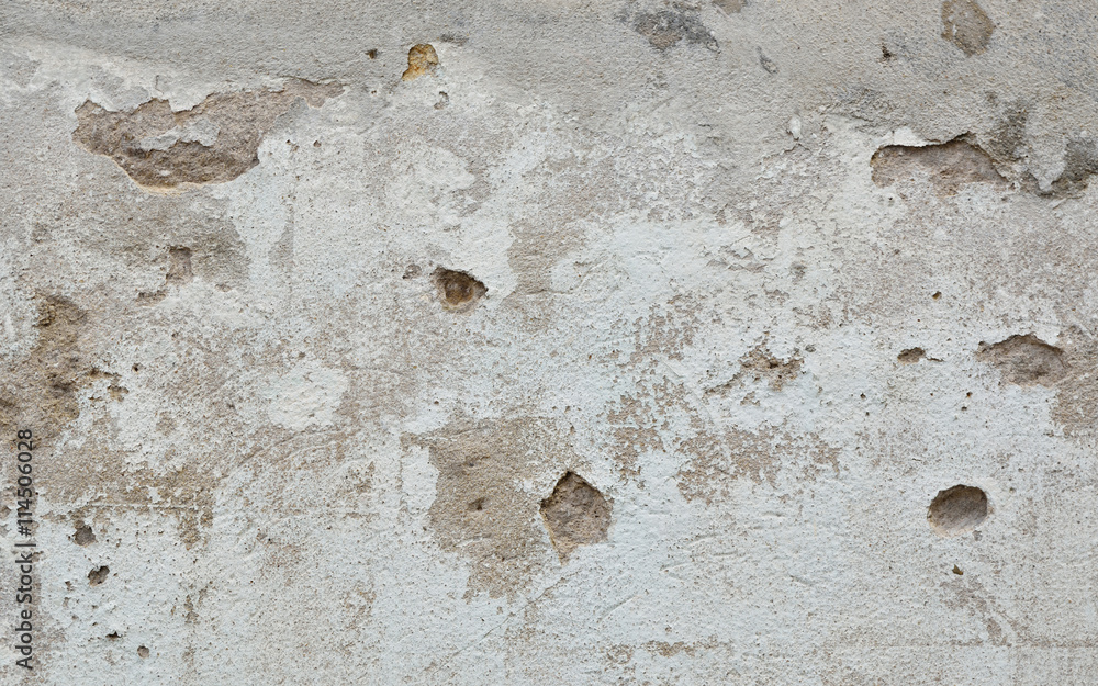 Old wall with cracks and peeling paint, texture background
