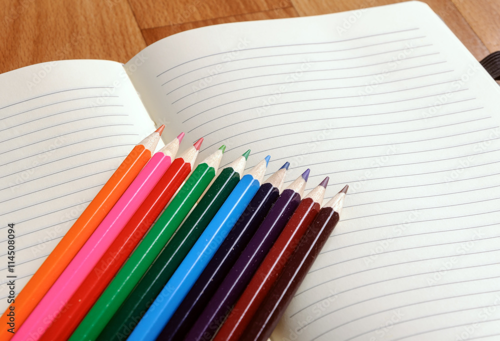 Blank notebook with color pencil. Education concept. Blank notebook with color pencil. Education concept.