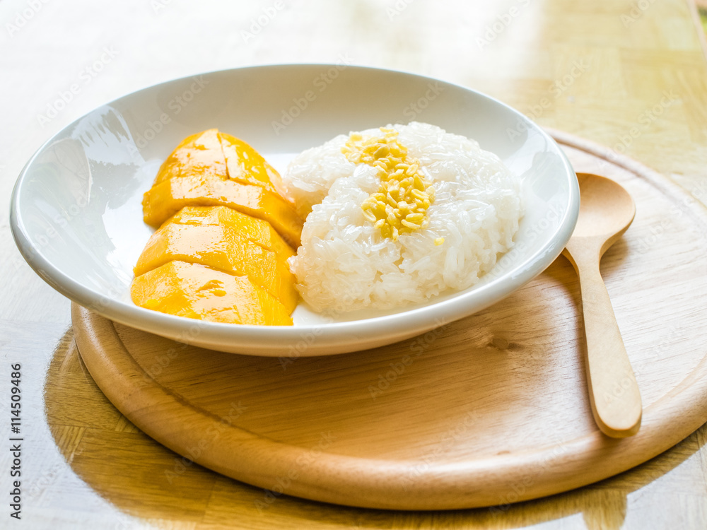 Mango with sticky rice on white plate Mango with sticky rice on white plate