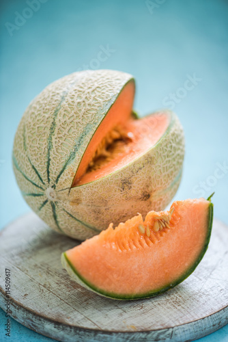 cantaloupe melon on wooden board