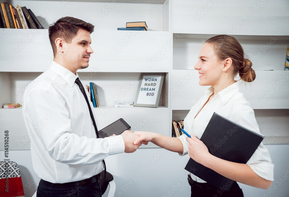 Woman adviser with a businessman. Handshake Woman adviser with a businessman. Handshake