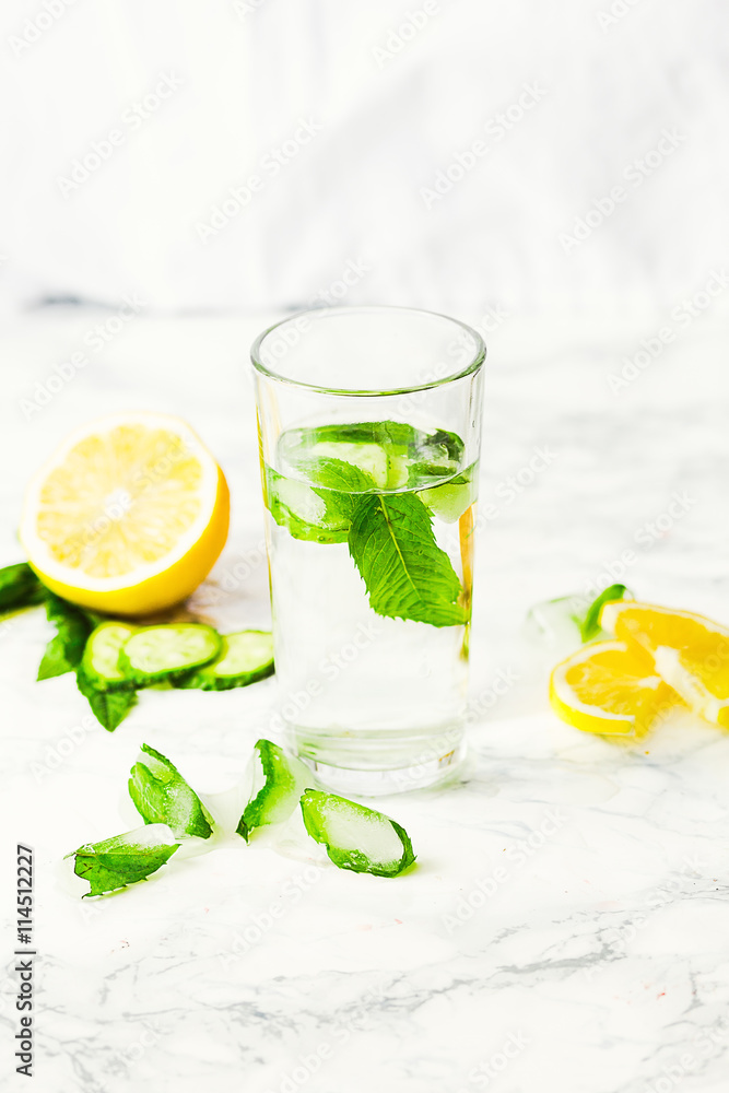 Fototapeta premium Lemonade with mint and ice in glass, morning, summer drink