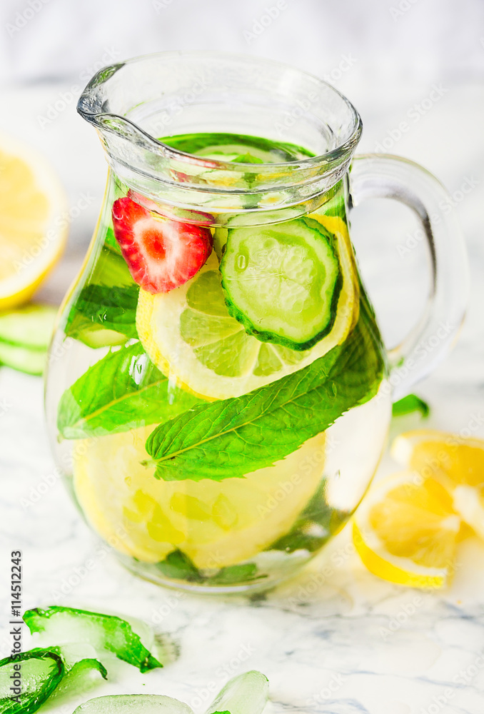 Lemonade with mint and ice in glass, morning, summer drink Lemonade with mint and ice in glass, morning, summer drink