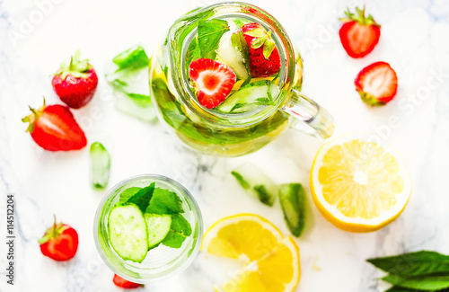 Water with strawberries  lemon  ice  mint. Detox.