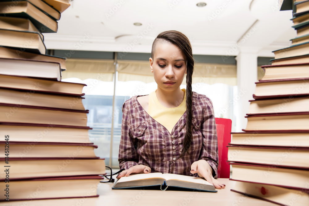 Young student with stack of books Young student with stack of books