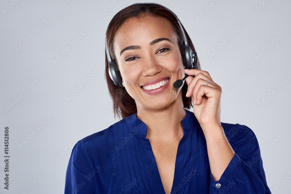Hispanic indian woman on the phone headset smiling Hispanic indian woman on the phone headset smiling