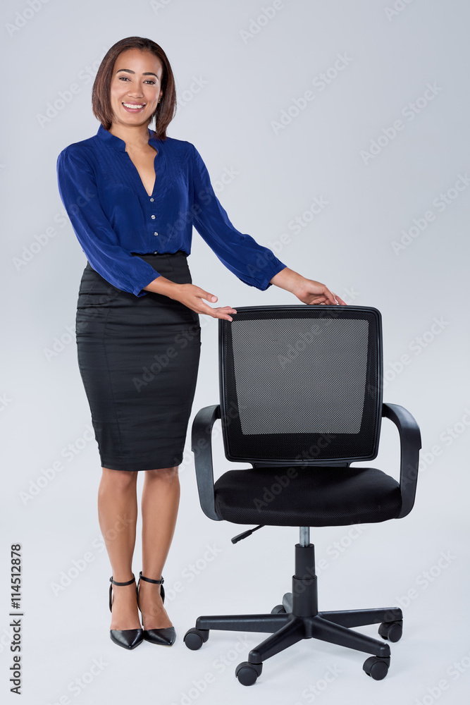 Young woman shows vacant empty office chair Young woman shows vacant empty office chair