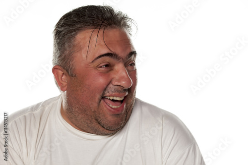 fat man laughing on a white background © vladimirfloyd