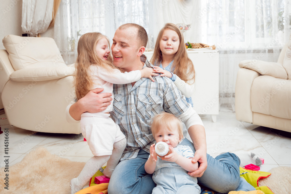 Cheerful family plaing at home. Cheerful family plaing at home.