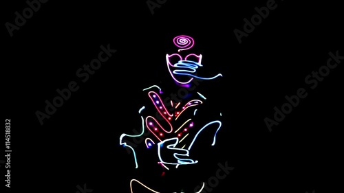 4 people dancing in costumes of LEDs 