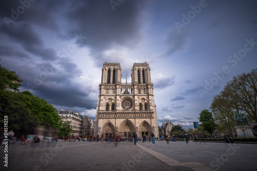 Notre Dame de Paris. France. Ancient catholic cathedral on the quay of a river Seine. Famous touristic architecture landmark in spring