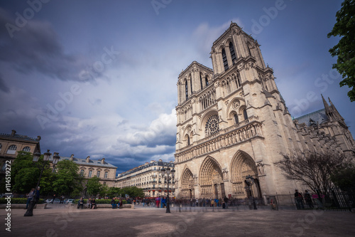 Notre Dame de Paris. France. Ancient catholic cathedral on the quay of a river Seine. Famous touristic architecture landmark in spring