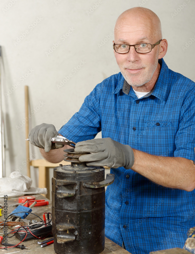 man with antique generator for the car Photos | Adobe Stock