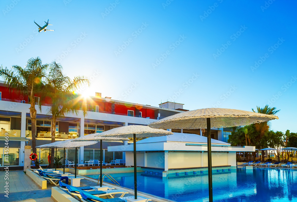 modern European resort. sun. flying the aircraft. pool with bar