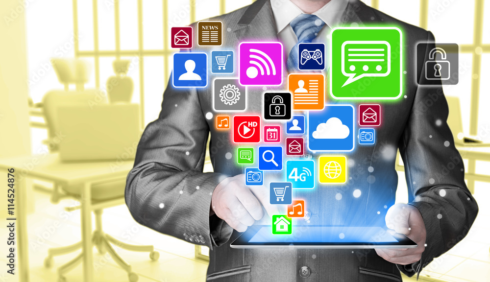 Business man using tablet PC with social media icon set Business man using tablet PC with social media icon set