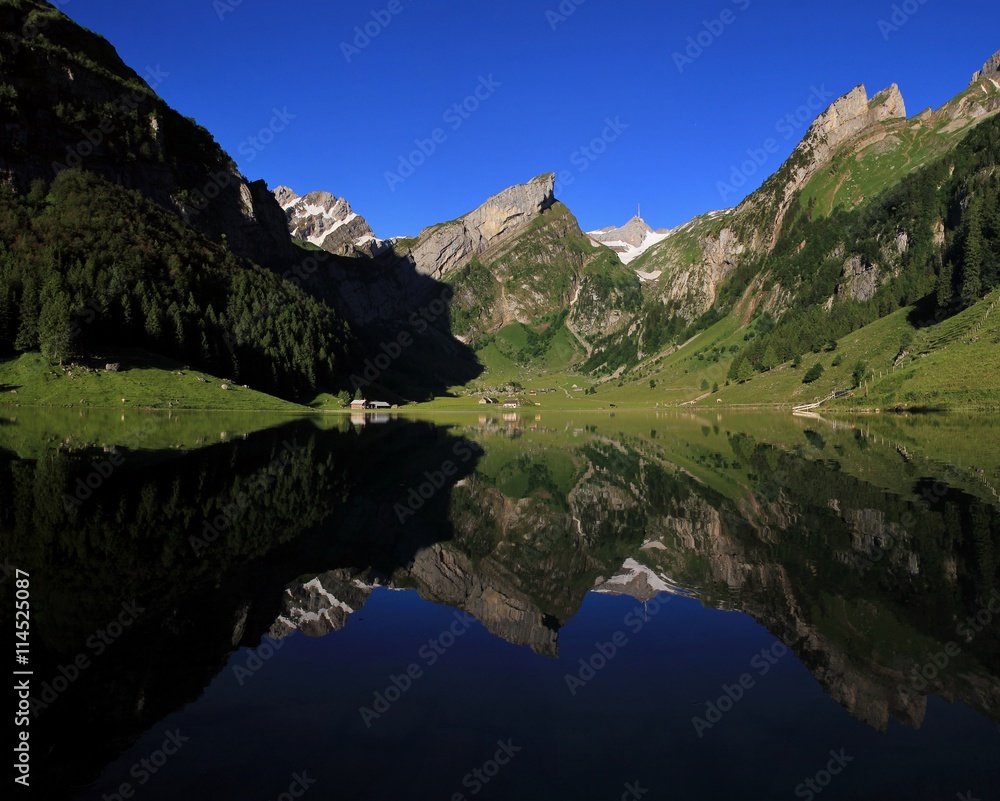 Alpstein Range mirroring in lake Seealpsee