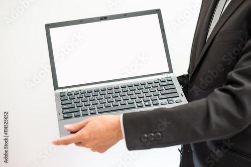 Handsome asian businessman working with laptop in office