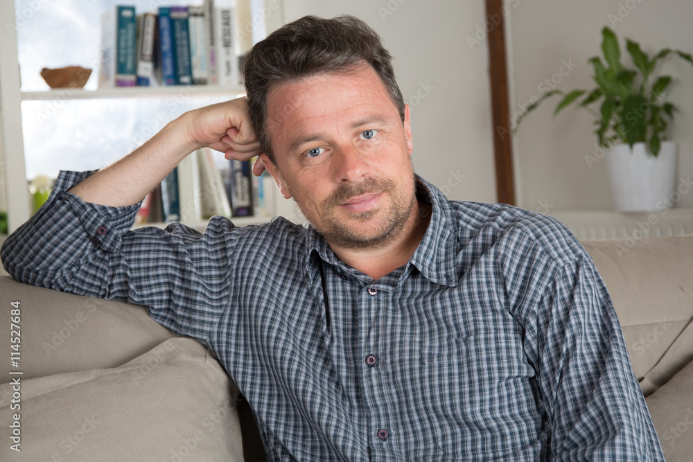 Man on the sofa at home relaxing Man on the sofa at home relaxing