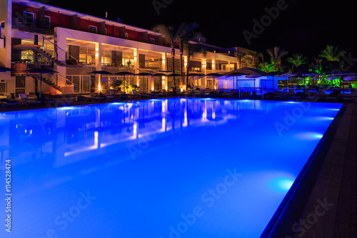 swimming pool with lighting in the spa modern European hotel at night