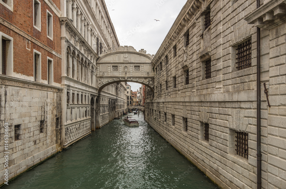The Bridge of Sighs sits across  the Canals and Waterways of famous Venice