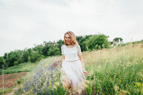 Wallpaper Mural beautiful girl in white dress lies in green grass Torontodigital.ca