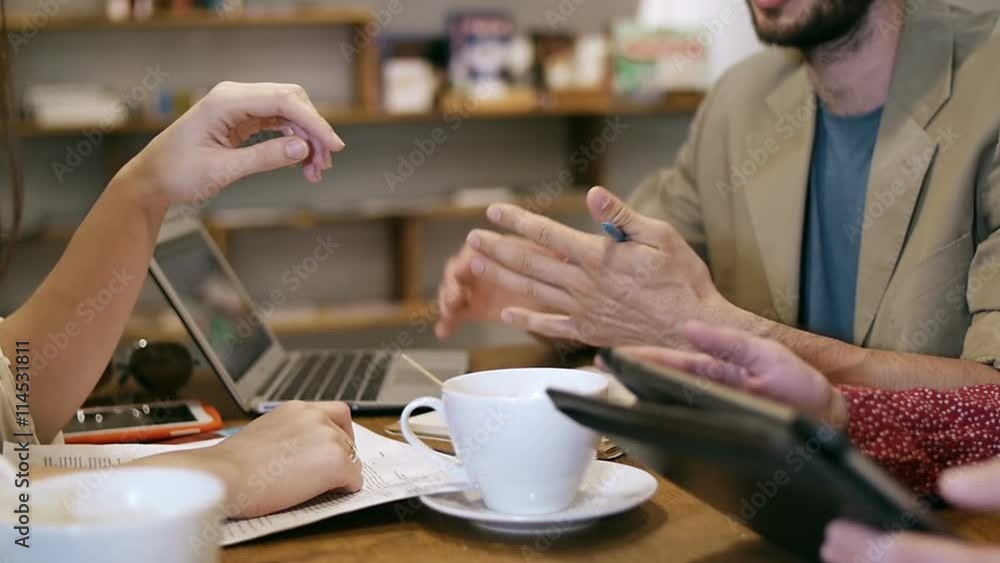 Closeup hands Business people meeting in cafe Closeup hands Business people meeting in cafe