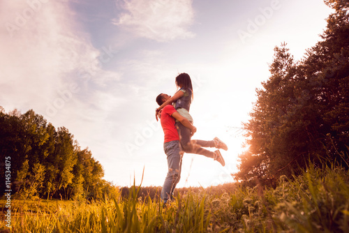 Young couple at sunset in the park.