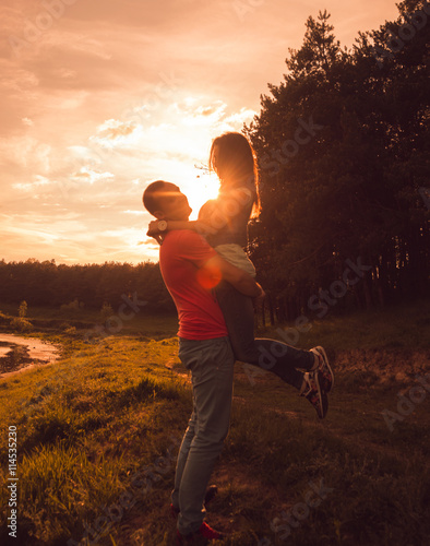 Young couple at sunset in the park.