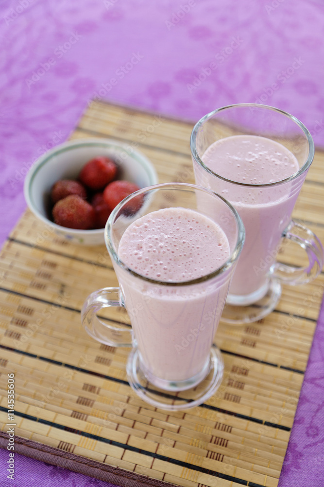 Milkshake with strawberries in a glass Milkshake with strawberries in a glass