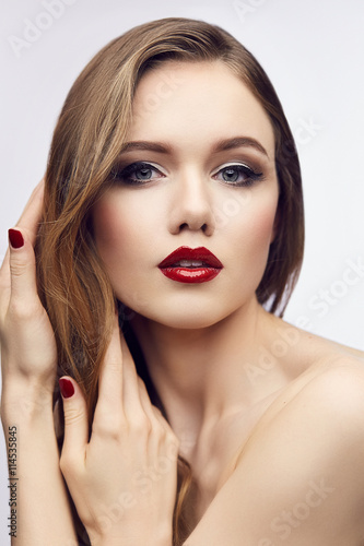 Red lips girl touching her hair