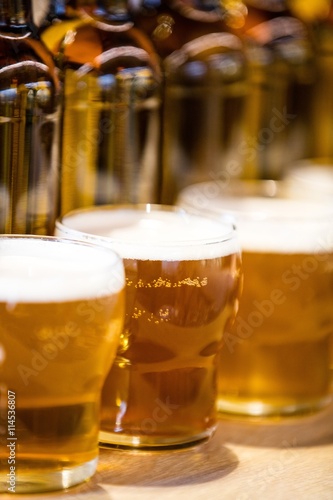 Obraz na plátně Close-up of beer glasses on the bar counter