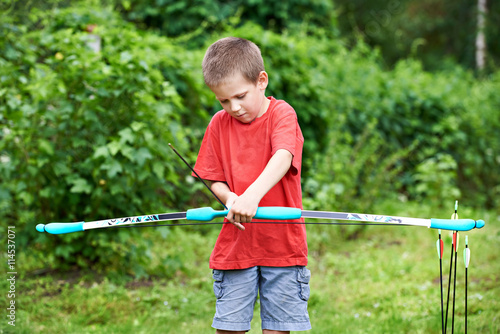Little archer with bow and arrows