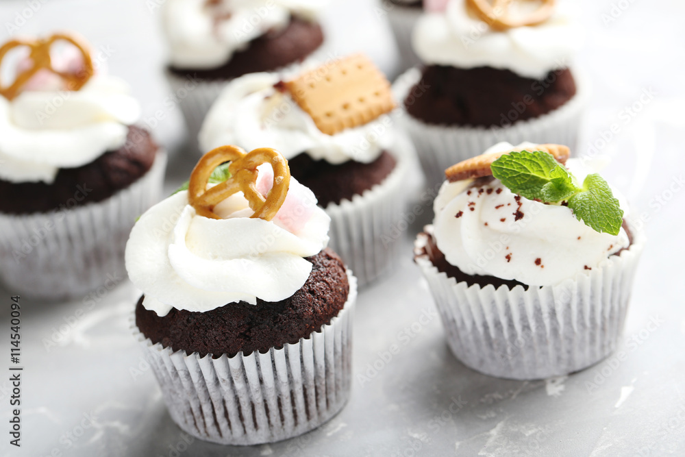 Chocolate cupcakes on a grey background Chocolate cupcakes on a grey background