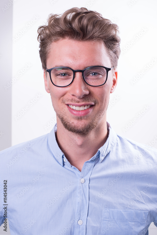 Portrait young smart Professional with blue shirt smiling into c