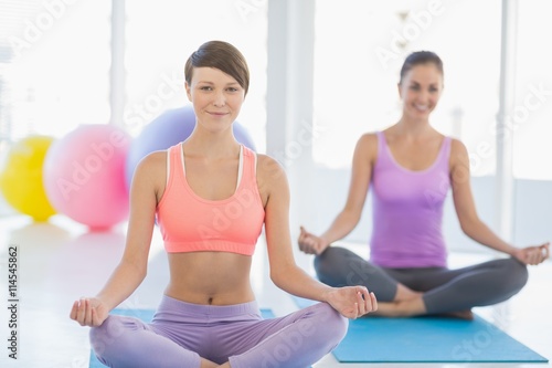 Smiling women exercising